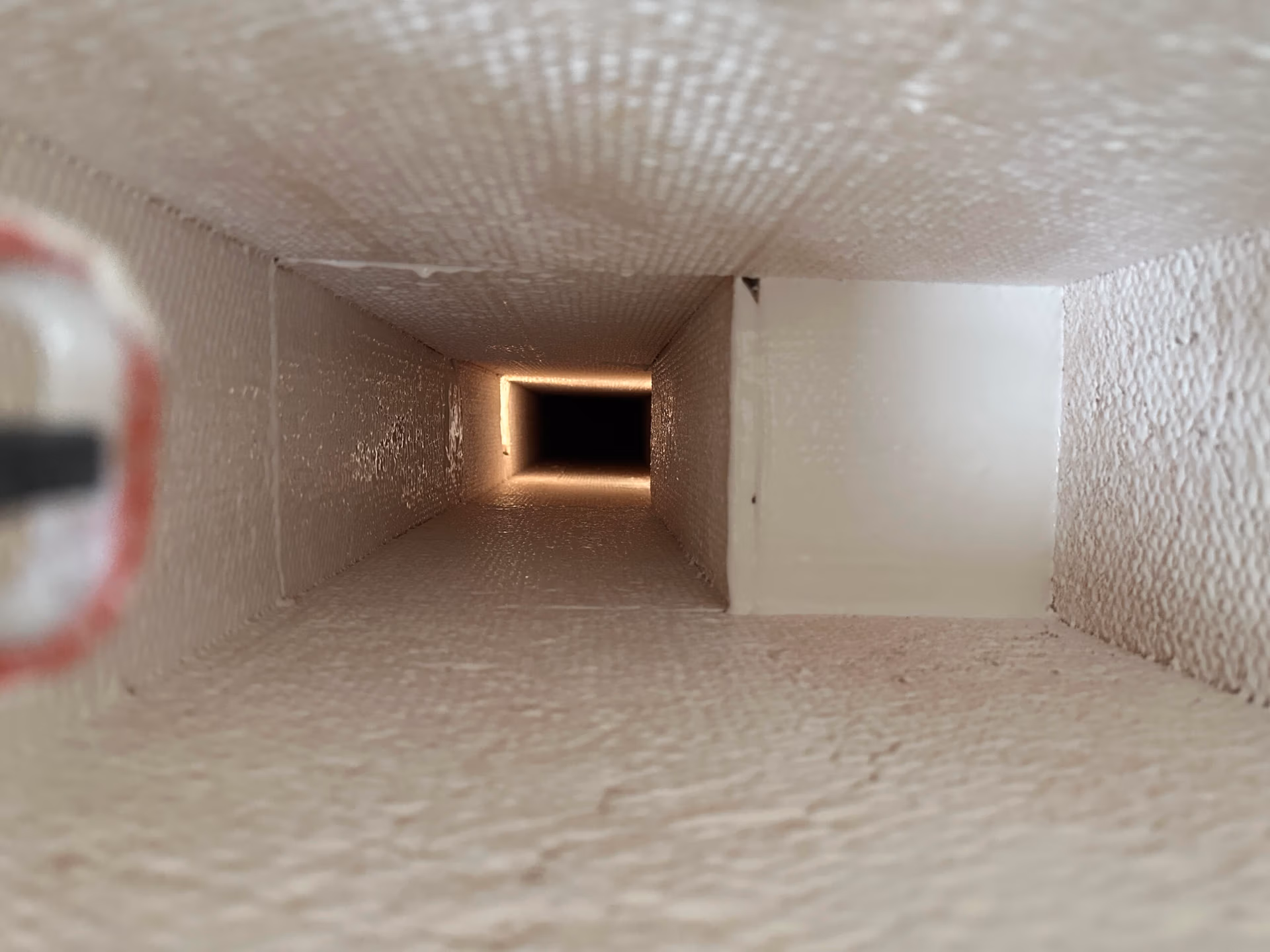 Interior of HVAC ductwork after professional cleaning and antimicrobial encapsulation, showing clean, sealed duct surfaces.
