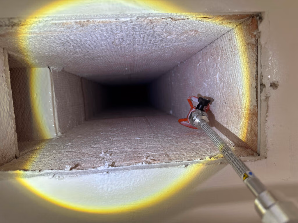 Interior of HVAC ductwork after antimicrobial encapsulation, showing evenly coated duct surfaces following professional duct cleaning and treatment.