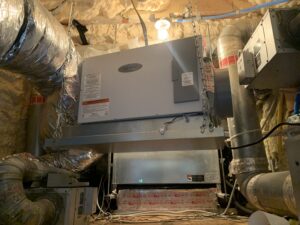 Dehumidifier and insulated ductwork in an attic.