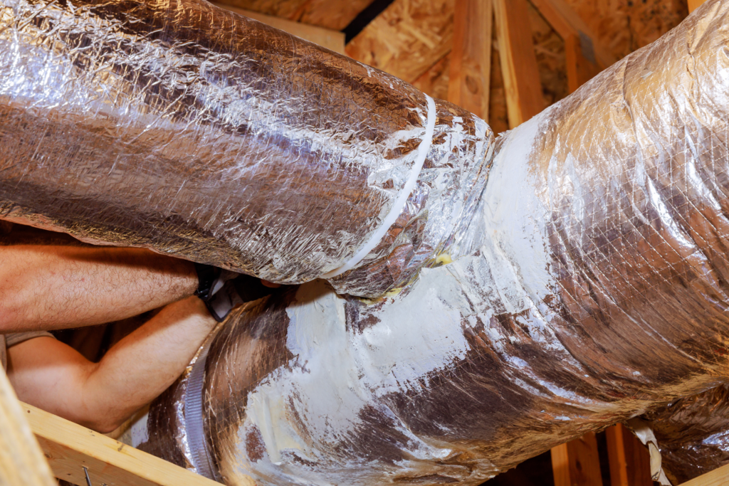 Attic ductwork with mastic sealant applied around junctions to ensure air tightness