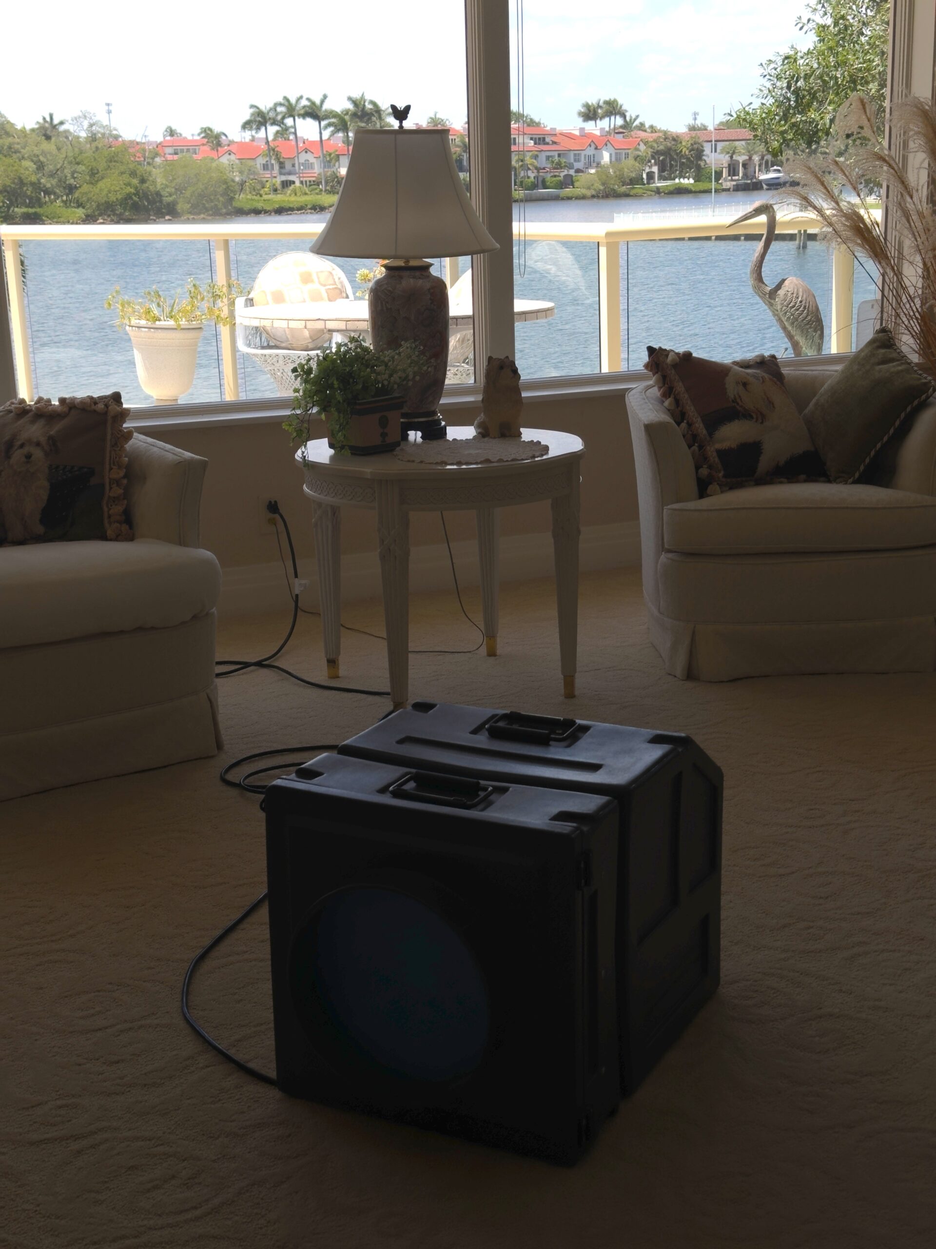 Odor mitigation machine operating in a residential waterfront living room to remove indoor air contaminants.