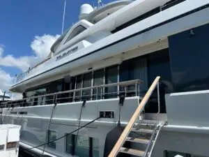 Luxury yacht docked at a marina, preparing for professional HVAC duct cleaning service.