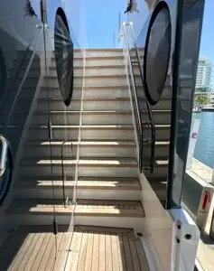 View of luxury yacht staircase leading to upper deck, photographed before HVAC duct cleaning service.