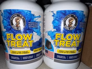 Two bottles of HVAC Flow Treat drain pan tablets used to prevent condensate drain line clogs and keep HVAC drain pans clean.