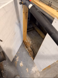 Uninsulated HVAC return cavity with visible moisture staining and rust, showing how condensation can damage ceilings and impact indoor air quality.