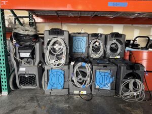 GreenFox Air Quality fleet of commercial air movers and dehumidifiers stored and ready for water damage restoration and structural drying jobs in South Florida