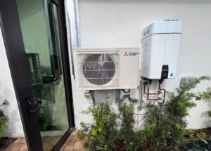 Mini split air handler on the side of a nice home in jupiter