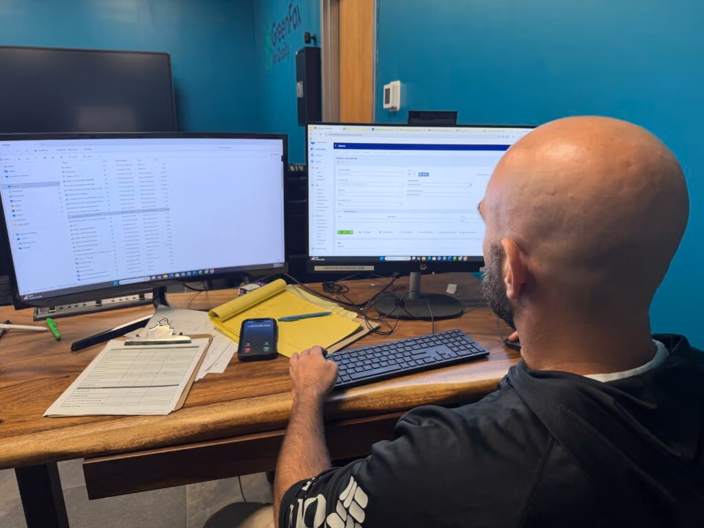 man writing estimate at green fox air