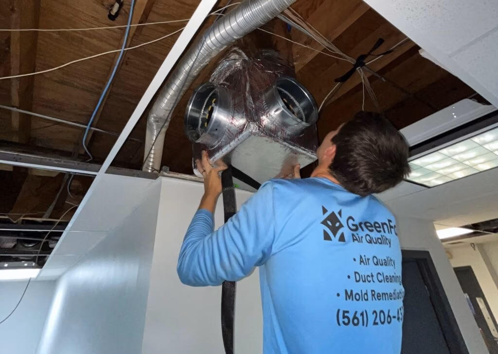 green fox technician installing new ductowkr