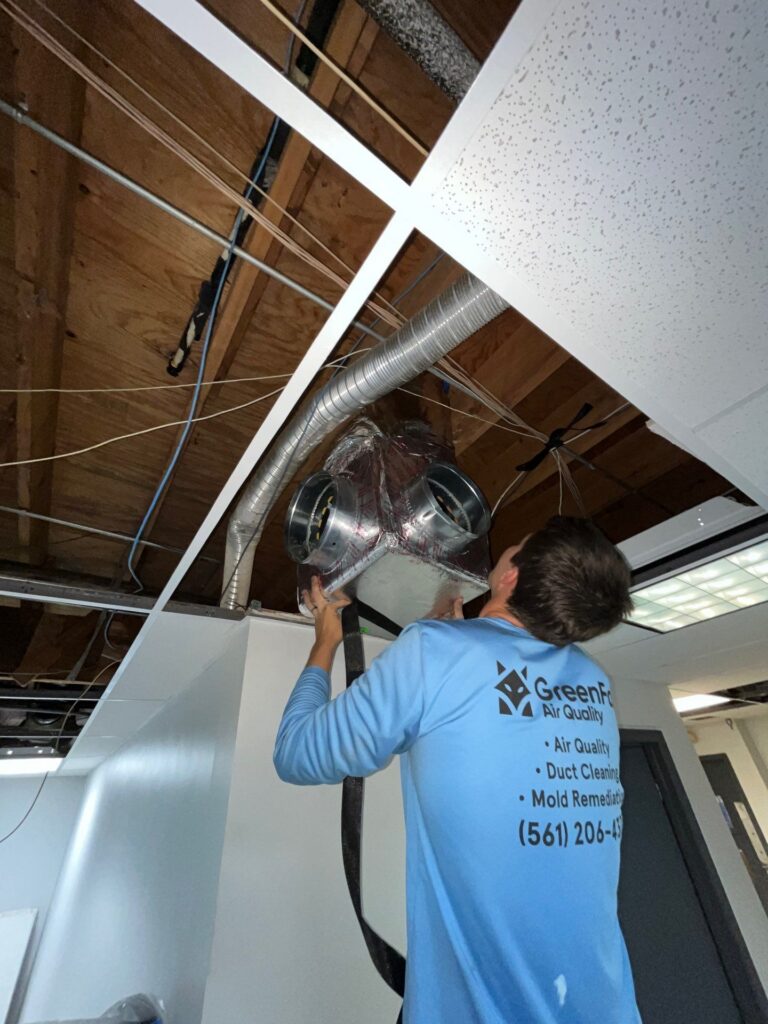 Duct work being instalkled by a green fox technician